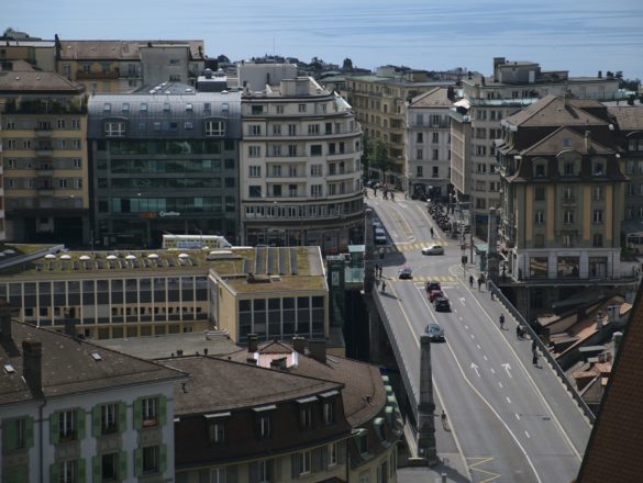 cars on road near buildings during daytime
