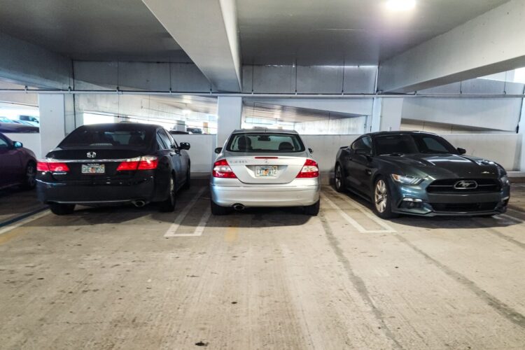 A group of cars parked in a parking garage