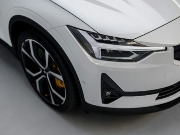 a white car is parked in a garage