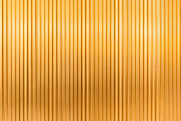 a gold metallic background with vertical lines