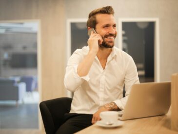 man using smartphone on chair